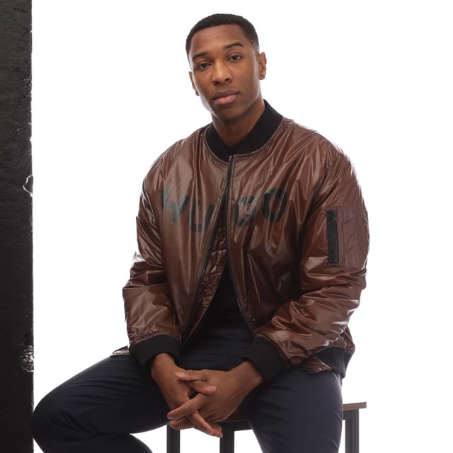 Mens HUGO Byler2431 Jacket in brown.- Ribbed bomber style collar.- Branded full front zip opening.- Two press stud entry pockets.- Zip entry pocket situated on the upper left sleeve.- Signature HUGO logo is printed on the chest.- All over padded design.- Ribbed cuffs and hem.- 100% Polyamide.- Ref: 50521233890