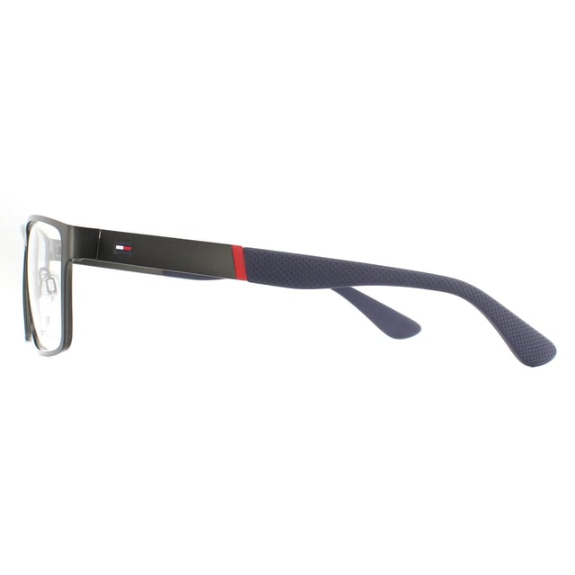 Tommy Hilfiger Glasses Frames TH 1543 R80 Matte Dark Ruthenium are a masculine rectangular design with a flat metal frame front and texture plastic temple tips. Adjustable nose pads guarantee comfort and the Tommy Hilfiger flag logo on the temples ensures brand recognition.