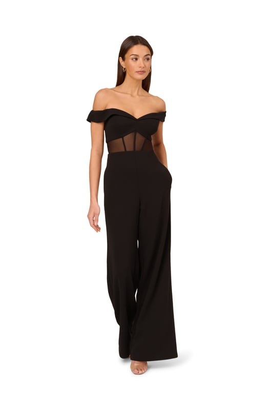 Go boldly to your next event in this sexy jumpsuit. This jumpsuit features an off the shoulder bodice with sweetheart neckline, wide leg trousers, and a sheer panel at the waist with boning construction for a corset effect. Crafted from knit crepe fabric, this eye-catching jumpsuit has some stretch. A stunning choice for every formal or black-tie affair, this off the shoulder jumpsuit is easy to style with your favourite neutral heels and simple metallic jewels. A zipper closure at the centre back completes this corset jumpsuit.