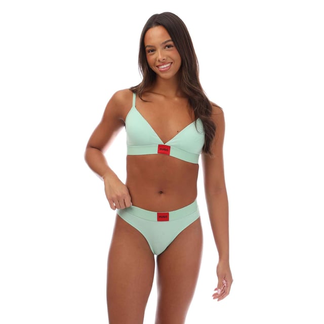 A signature triangle bra featuring a red logo label on the band by HUGO Womenswear. This design is crafted in stretch jersey with removable padding. This product is partly made with organic cotton.