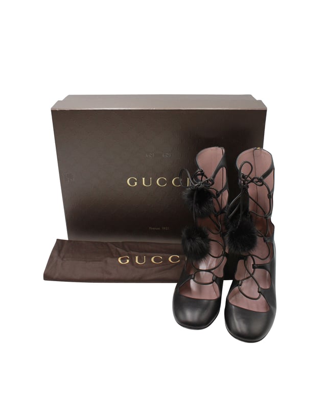 VINTAGE, RRP AS NEW
Gucci shows off its playful side with the 'Heloise' embellished ankle boots. A smooth black leather upper is accented with a gold-tone heel that amps up the glam factor. The lace-up design features mink fur pompoms that are made to move as you walk. Show off the statement beauts to full effect by teaming them with mini hemlines.


Gucci Heloise Lace-up Gladiator Boots In Black Leather
Condition: very good
Material: Leather
Size: 38
Sign of wear: wear on soles
SKU: 259593