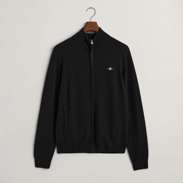 Crafted from 100% superfine lambswool  this GANT cardigan is a great addition to any wardrobe. Designed for a regular fit  it features front zip closure  side pockets  ribbed detailing at the neck  hem and cuffs and a small-scale shield graphic embroidered on the chest.