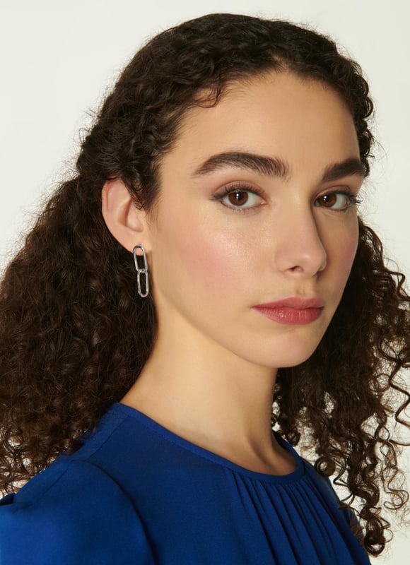 Sleek, stylish and understated, our Lily earrings are a chic addition to our jewellery collection this spring. Crafted from silver-tone brass, they are a long style of two interlocking links with a simple post and butterfly back fastening. Wear them to dress up simple tees or with your favourite dresses when the season's occasions are in full swing.