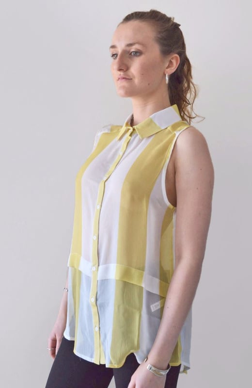 Button Front with Collar Neckline, Curved Hemline and tuck feature below waist. Lightweight Sheer Crepe Fabric, Sizing is as expected, Length: 27" Shoulder to Hem