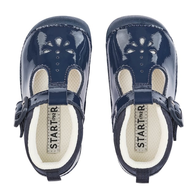 Designed to protect babies' delicate feet, these comfortable T-bar shoes comes in a soft navy patent. Specifically designed for pre-walkers, there are padded ankles and cushioned insoles to provide ultimate comfort for babies feet. Heel and toe bumpers protect delicate feet and our most flexible, lightweight soles allows for uninhibited movement. The easy buckle fastening means fuss-free adjustability and ensures shoes stay put on the move.