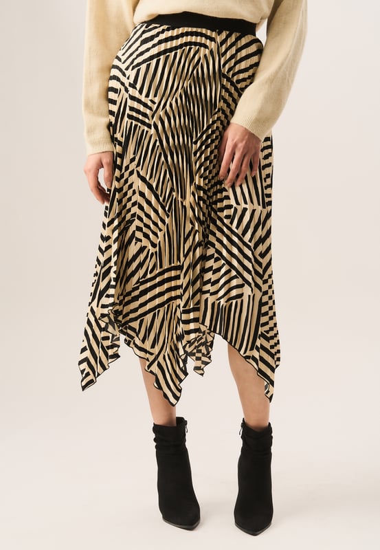 This Beige Asymmetric Hem Pleated Midi Skirt is perfect for any special occasion. It features a high-quality pleated construction that moves gracefully with your body while delivering a contemporary, asymmetric hemline. This skirt is sure to make a statement.