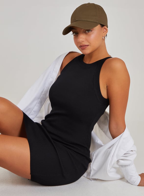 Don't miss out on the party wear piece of the season! This Racer Back Ribbed Mini Dress will keep all eyes on you. Pair with strappy heels for a trend-worthy look.