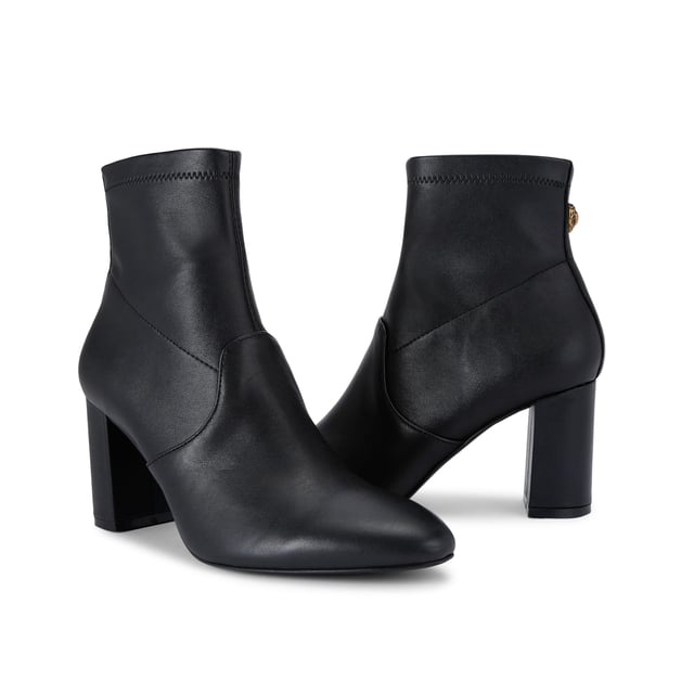 The Kurt Geiger Langley Ankle Boot features a black leather upper. The ankle features a zip closure and antiqued brass eagle head on the back. Heel height: 8cm.