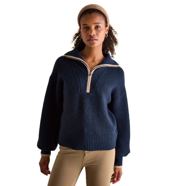 Elevate your knitwear this season with the Elmore navy jumper. Its quarter zip fastening and dropped shoulders gives it an effortless 'throw on' feel, that will keep you comfortable and stylish. The oversized ribbed collar adds interest and features contrasting colour tipping. It's finished with a ribbed hem and cuffs. Style over a slim-fitting top for a layered-up look and your favourite pair of jeans.