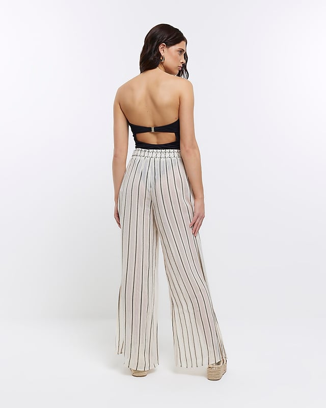 Stripe print, Mid rise, Flared design, Split hem, Elasticated waist, Made with at least 50% sustainable viscose, Our model wears a UK 8 and is 175cm/5'9'' tall