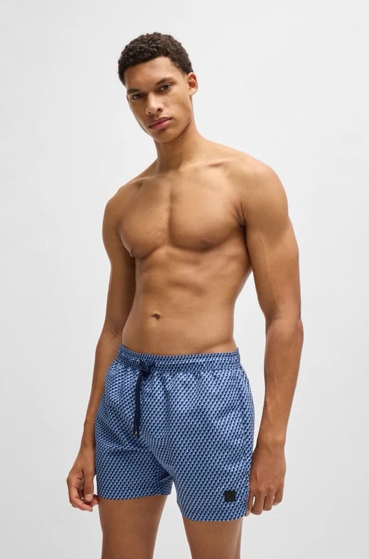 The model wears a size M and is 189 cm tall with a, 95 cm chest, 73 cm waist and 94 cm hips
50518968
Refined swim shorts by BOSS, designed with an all-over seasonal print. This fully lined pair is trimmed with a drawcord and logo label. This product is partly created with recycled polyester. We at HUGO BOSS prefer recycled polyester from pre- and post-consumer textile waste and do our best to phase out polyester from PET bottles. The aim of using recycled materials is to save valuable resources.