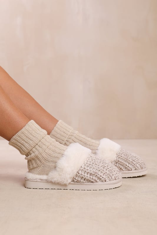 Experience ultimate comfort and cozy warmth with our Lounge Slip On Knitted Slippers With Fur Trim. These luxurious slippers are perfect for lounging at home or keeping your feet snug during colder seasons.Key Features:



Soft Knitted Upper: The knitted upper design adds a touch of style and texture to these slippers, while also providing a comfortable and cozy feel.

Faux Fur Lining: The Faux fur lining envelops your feet in warmth and softness, making these slippers a cozy sanctuary for tired feet. Say goodbye to cold toes and hello to ultimate comfort.

Easy Slip-On Design: These slippers feature a slip-on design, allowing you to effortlessly slide your feet in and out of them. Perfect for those relaxed and casual moments when you need to quickly put on cozy footwear.

Durable Sole: The durable sole provides traction and support, making these slippers suitable for both indoor and outdoor use. Enjoy the versatility of being able to step outside without changing your footwear.

Specifications:Material:


Upper: Synthetic
Lining: Faux fur for warmth and coziness
Sole: Durable sole for indoor and outdoor wear


Closure: Slip-on design for easy and convenient wearing

Pamper your feet with our Lounge Slip On Knitted Slippers With Fur Trim. Indulge in the utmost comfort and enjoy the luxurious feel of these slippers while effortlessly adding warmth and style to your everyday relaxation routine. Say hello to cozy evenings and happy feet with our irresistible slippers.