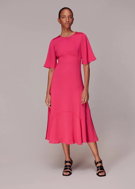 Embrace elegance with the Alana Satin Dress, a stunning pink midi perfect for any soirée. Crafted from 100% recycled polyester, this eco-conscious piece features a chic cut-out design and short sleeves. Its flowing silhouette ensures a flattering fit for all, making it an ideal choice for your next evening out.