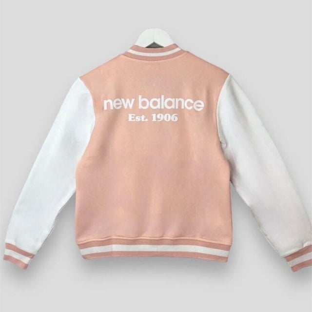 New Balance Womens Varsity Jacket Fleece Contrast Girls Bomber Sweat Jacket     
Regular-fit Jacket is Cut From a Soft and Breathable Cotton Fabric for Lasting Comfort     
This Jacket Features a Button Fastening for Customisable Coverage Whilst Ribbed Trims Optimise the Fit     
Side Pockets     
New Balance Branding to the Chest and Back     
Machine Washable