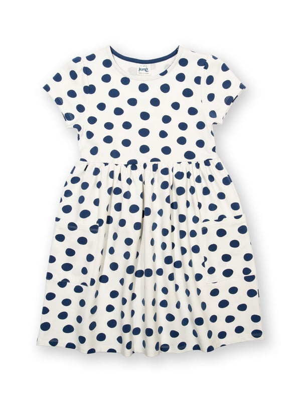95% organic cotton 5% elastane | Proud to be certified to the Global Organic Textile Standard (GOTS) | Big spot all-over print | Cream and navy blue | French terry loop back fabric (240-250 gsm) | Coconut button shoulder opening (up to and including size 3 years) | Patch pockets | Short sleeved | Round neck | Made in Turkey | Machine washable at 40 degrees, or at 30 degrees to be kinder to the planet