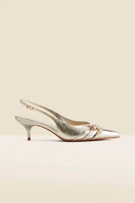 Luxe up your lookTimeless slingback style with a sleek pointed toeSet on a comfy-chic kitten heel Elevated with a statement buckle strap detail Adjustable strap for the perfect fit Dress them down with denim, up with