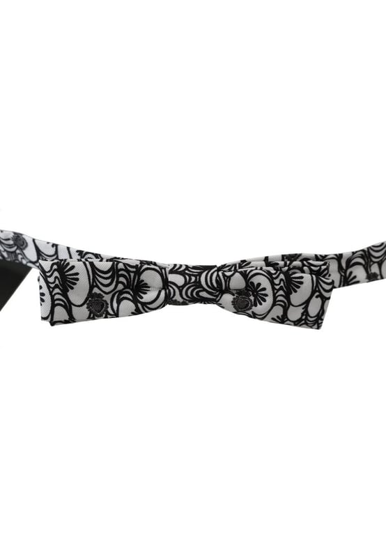 100% Authentic Dolce & Gabbana bow tie
  From the exclusive Dolce & Gabbana collection
  Color: White black with pattern
  Model: Tied
  Material: 100% Silk
  Adjustable length neck strap one size
  Made In Italy
  Original tags & store bag included