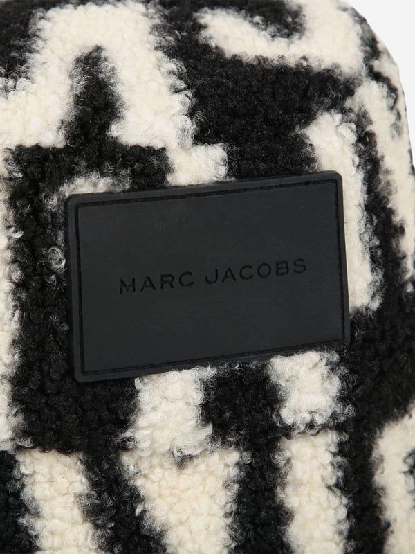 Introducing the Kids Faux Shearling Bucket Hat in Black by marc_jacobs, essential for AW2024. This chic accessory promises style and warmth for both boys and girls. Discover its standout features:‚ Luxurious Faux Shearliner: Offers a plush feel and maximum warmth.‚ Signature Black: Versatile and classic, complements any outfit.‚ Designer Craftsmanship: marc_jacobs's attention to detail ensures durability.Elevate your child's wardrobe with this stylish piece. Shop now to add a touch of elegance to their cool-weather look!