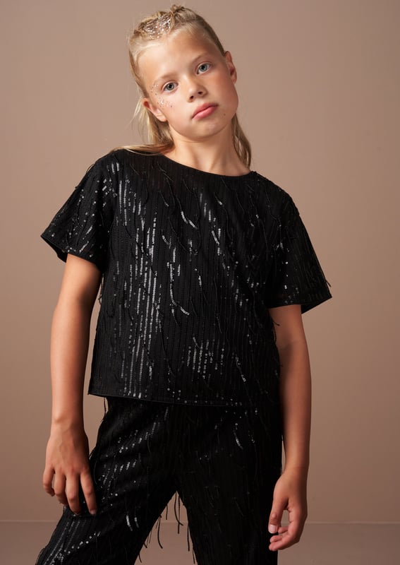 Glitter. shimmer and sparkle in our fabulous short sleeve shell top in elegant  . With swishy sequin tassels. you'll make an entrance to any party. Wear with the matching trouser for ultimate outfit credits.