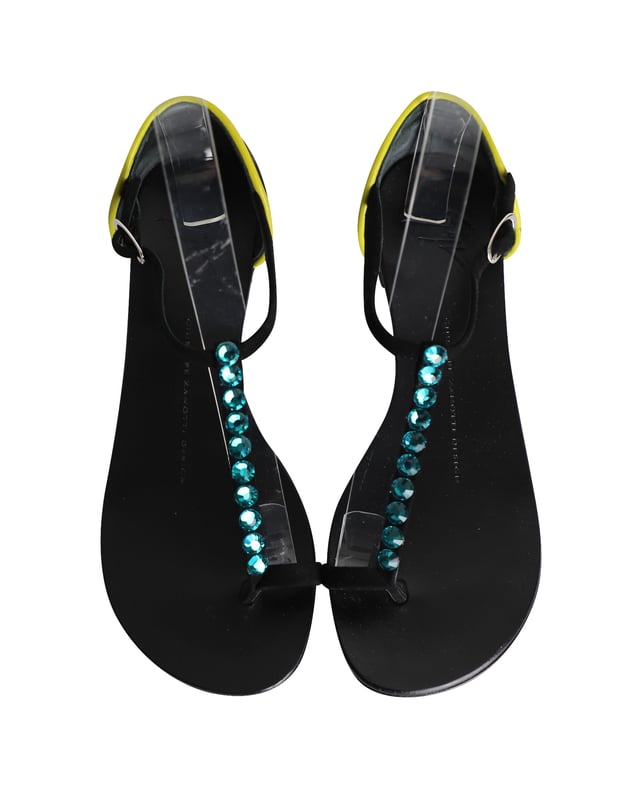 VINTAGE, RRP AS NEW
Crafted with comfortable flat soles, this gorgeous pair of t-strap sandals is embellished with crystals for a luxe look. With buckled ankle straps, the leopard print heel counter adds flair for the finishing touch.

Giuseppe Zanotti Crystal-Embellished T-strap Flat Sandals in Multicolor Leather
Condition: Good with dust bag and box
Sign of wear: Moderate wear on the soles 
Material: Leather
Color: Multicolor
Size: IT36 / UK3 / US6
SKU: 301843