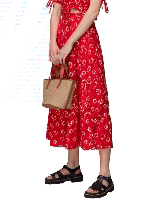 Brighten up your daywear with this vibrant Red Floral Tiered Midi Skirt. Its eco-friendly fabric and cheerful floral tie dye print make it perfect for a leisurely weekend outing or a casual meet-up with friends.