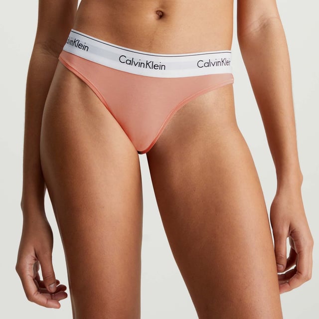 Womens Calvin Klein Modern Cotton Thong in pink.- Calvin Klein signature elastic waistband.- Medium rise waist.- 53% cotton 35% modal 12% elastane.- Ref: 0000F3786ELWG