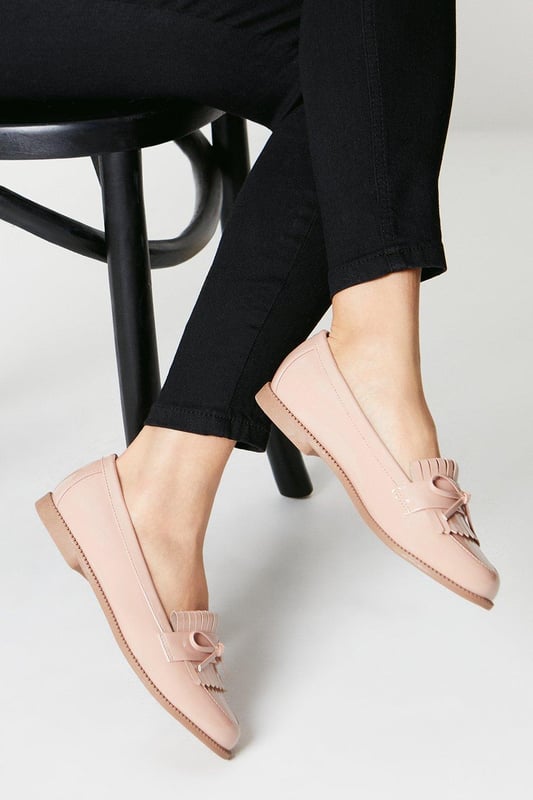 Faux leather loafers with a wide fit for added comfort
Stylish tassel detailing adorns the vamp
Moccasin-inspired stitching adds a touch of flair
Flat heel offers all-day wearability
Versatile design suitable for day-to-night occasions

Effortlessly transition from desk to dinner with these chic wide fit loafers from Dorothy Perkins. The faux leather construction exudes a polished look, while the tassel embellishments and moccasin-inspired stitching lend a touch of playfulness. Pair them with tailored trousers for a sophisticated workwear ensemble, or team them with a flowy dress for a casual yet refined weekend brunch look. With their flat heel, these versatile loafers offer all-day comfort, making them an ideal choice for any occasion.