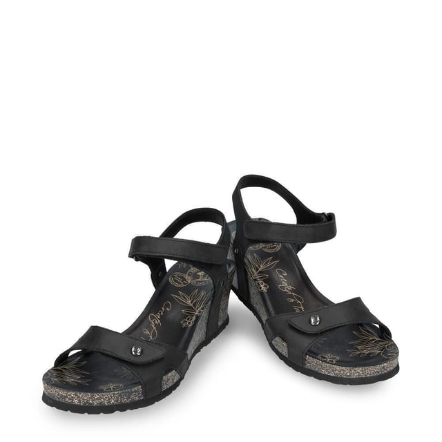 Introducing the Panama Jack Julia B1 Wedge Sandals in Black Leather, where style meets comfort for the modern woman. Crafted with exquisite detail and superior materials, these sandals are the perfect blend of elegance and practicality. Description: Step into sophistication with the Velcro Closure and black oiled Napa leather construction, offering a secure and adjustable fit with timeless appeal. Experience luxurious comfort with leather lining and anatomical insole, providing cushioning and support for all-day wear. Elevate your look with the 6 cm wedge heel, adding height without compromising on stability. Navigate any surface with confidence, thanks to the lightweight, flexible, strong, and non-slip EVA rubber sole, ensuring traction and durability. Made in Spain, these sandals showcase quality craftsmanship and attention to detail for long-lasting wear. Bullet Points: Velcro Closure for easy adjustmentBlack oiled Napa leather construction for durability and styleLeather lining for added comfortAnatomical insole for enhanced supportLightweight, flexible, strong, and non-slip EVA rubber sole for stability and traction
