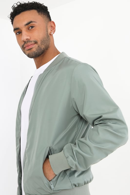 This bomber jacket from Brave Soul is a stylish and comfortable addition to your wardrobe. The ribbed hem, collar, and cuffs provide a classic touch, while the two lower zip pockets add a practical element to the jacket. With a regular fit, this jacket offers a relaxed yet trendy look and is fully lined. Whether you're heading out for a night out or running errands, this bomber jacket is sure to keep you comfortable and stylish.