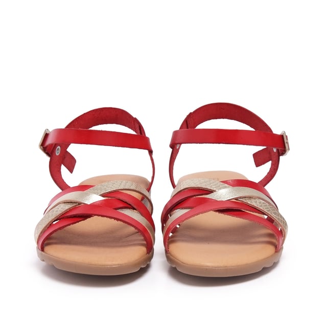 Flat leather sandal with five crossed strips. Closure: metal buckle. Upper, inner an insole : leather. Sole: Non-skid TR caramel color. MADE IN SPAIN.