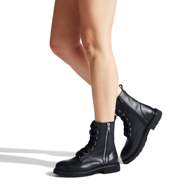 Make light work of autumnal dressing with the new Strategy 2 boot. This combat inspired ankle boot is crafted in black leather for enduring style and is accompanied by a cleated outsole, heavy duty silver zip fastening, and secure lacing system.  The wide, velvet touch laces add feminine appeal to the edgy biker styling.