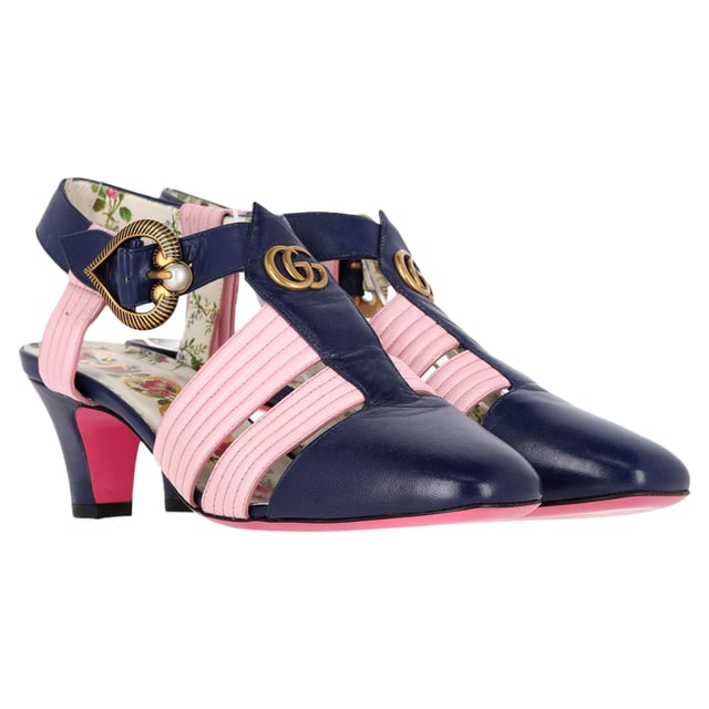 VINTAGE, RRP AS NEW
Step into luxury with the Gucci GG Logo T-Strap Mid-Heeled Sandals in vibrant blue and pink leather. These eye-catching sandals feature the iconic GG logo, beautifully blending high fashion with playful color. The T-strap design provides a flattering silhouette, while the mid-heel offers comfort and stability for all-day wear. Perfect for dressing up a casual outfit or adding flair to an evening ensemble, these sandals are a versatile addition to your footwear collection. Elevate your style and make a bold statement with these stunning Gucci sandals.

Gucci GG Logo T-Strap Mid-Heeled Sandals in Blue and Pink Leather

Condition: Very good
Signs of wear: Minor signs of wear
Packaging: Dust bag
Color: Multicolor
Material: Leather | leather
Size: EU36.5/UK3.5/FR37.5/IT36.5/US6.5
Measurements: Heel height: 80; Insole length: 260
SKU: NAPPUGBSH400793W