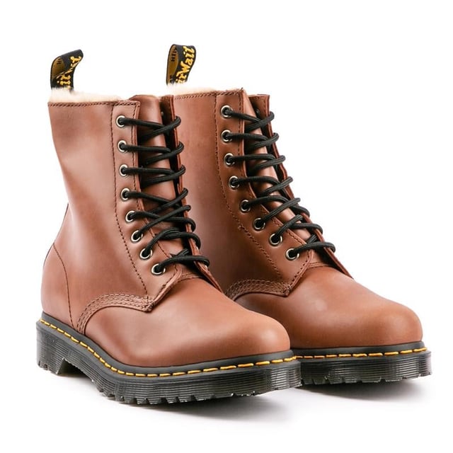 The Women's Brown Dr. Martens 1460 Serena Ankle Boots Bring It To The Point - Timeless, Stylish, Alternative, With A Premium Leather Upper, A Warm Faux Fur Lining And Sock, The Iconic Yellow Stitching And The Famous Air-cushioned Airwair Sole, Which Gives Them The Real Doc Martens Edge. Featuring Goodyear Welt And A Rugged Treat For Enhanced Durability And Sturdiness. These Boots Definitely Stand Out From The Crowd.