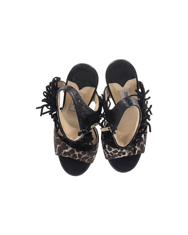 VINTAGE, RRP AS NEW
Add a touch of wild elegance to your footwear collection with the Jimmy Choo Leopard-Print Fringe Sandals. The leopard print is a bold choice that instantly elevates any outfit. The fringed details add a bohemian and eclectic touch, giving these sandals a unique and playful vibe. With an open-toe design and high heels, they are both stylish and flattering.

Jimmy Choo Leopard-Print Fringe Sandals in Black Leather
Condition: Very good with box
Sign of wear: Light wear on the soles and insoles, marks on the heel
Material: Leather
Color: Black
Size: IT36.5 / US6.5 / UK3.5
SKU: 357150 / TONPUGBSH357150W