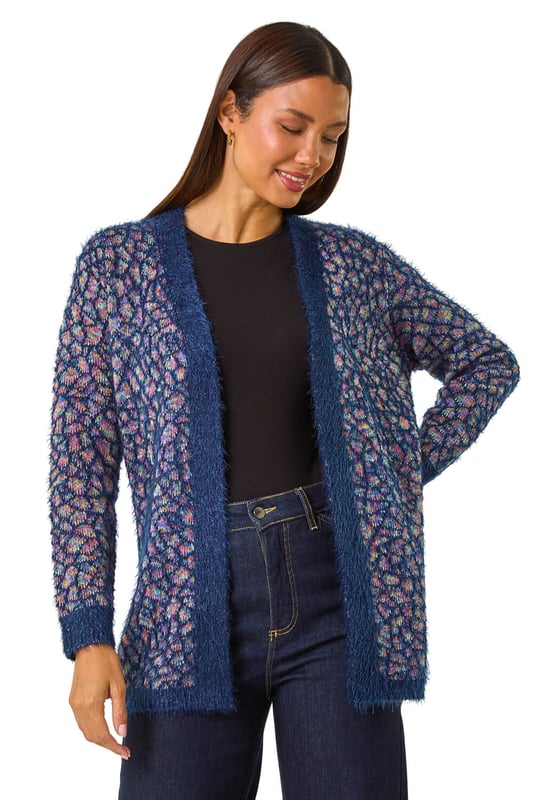 Mosiac Fluffy Trim Cardigan from Roman. Stay stylishly warm this Winter with our mosaic fluffy cardigan. This cosy piece features a unique mosaic design with a contrasting placket and cuff details, adding a touch of interest to your look. The long sleeves and secure edge to edge front provide extra warmth, while the longline length gives a flattering silhouette. Pair with a simple t-shirt and jeans for an effortlessly chic and cosy outfit.