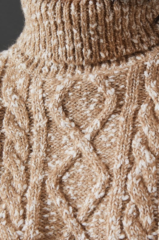 Intricate cable knit pattern for a textured look
        Cosy roll neck design for extra warmth
        Relaxed, oversized fit for comfort and style
        Dropped shoulders for a contemporary silhouette
        Ribbed cuffs and hem for a snug finish
    
    This Cable Knit Roll Neck Jumper from Warehouse is the epitome of casual chic. The intricate cable knit pattern adds depth and interest to your outfit, while the oversized fit creates a relaxed, effortless vibe. Perfect for those chilly autumn days or cosy winter evenings, this jumper is versatile enough to dress up or down. For a laid-back look, pair it with wide-leg jeans and trainers, as shown in the image. To dress it up a bit, try tucking the front into a leather midi skirt and adding ankle boots. The neutral tone makes it easy to style with various colours and textures in your wardrobe. Whether you're heading to a casual family gathering or meeting friends for a coffee, this jumper will keep you warm and stylish. Its timeless design ensures it will remain a staple in your wardrobe for seasons to come.