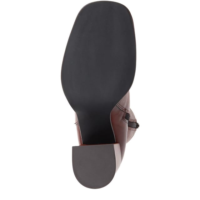Cultivated elegance meets edgy design with these heeled leather ankle boots. Elevate every stride; the city streets are your new catwalk.