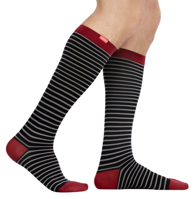 Energize your legs! Using integrally-knit graduated compression, these compression socks apply therapeutic pressure that starts at the ankle and gradually eases above. It’s this external pressure that energizes your legs and Reduces Swelling. These socks have a 30-40 mmHg compression level that is ideal for all-day, everyday wear, sitting or standing for long periods. High-quality premium nylon fibers and Spandex throughout the sock allow for sustained compression throughout the day. Alleviate achiness & heaviness by squeezing the legs from the bottom up, our legwear can help increase circulation of freshly oxygenated blood back to your legs. These are made for people with circulation problems and also ideal for flight travel, pregnancy, exercising, when sitting or standing for long periods of time and even during visits to hospital. These socks are specially designed to energise legs, reduce swelling, alleviate achiness & heaviness and to aid in muscular recovery. The specially designed fabric nylon and The 400-needle count gives supreme comfort and flexibility which contours leg and heel for superior fit. These socks are comfortable and breathable with graduated compression from ankle to calf with a contoured leg and heel for a great fit. The flexible toe pocket doesn’t squeeze the toes! They are also the extra wide style to fit comfortably around the wider legs and calves. Tested & Trusted: Based out of Missoula, Montana, VIM & VIGR is dedicated to creating products that provide you with everyday relief. VIM & VIGR graduated compression legwear was developed in partnership with vascular surgeons and vein clinics and all products are listed with the Food and Drug Administration (FDA). These compression socks are available in Blue/Grey, Blue/Moss, Slate Blue/Maroon and 3 sizes: Small/Medium, Medium/Large and Large/X-Large. They’re made out of 91% Nylon, 9% Spandex (Latex-free) and are machine washable.