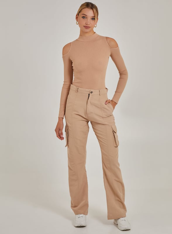 Need a last minute addition to the perfect outfit? Look no further. This Cold Shoulder Ribbed Bodysuit is the wardrobe essential you'll need this season.