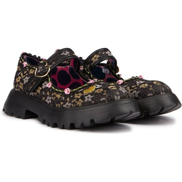 Lightweight And Romantic, These Black Mary-jane Shoes Sweet Surprise By Irregular Choice Are The Ideal Addition To Your Spring Outfits. For The Ultimate 90's Trend Look Wear With A Maxi Skirt Or Flared Trousers And Matching Tank Top And Cardigan Combo. Buckle Up These Chunky Tread Flats And You're Good To Go!