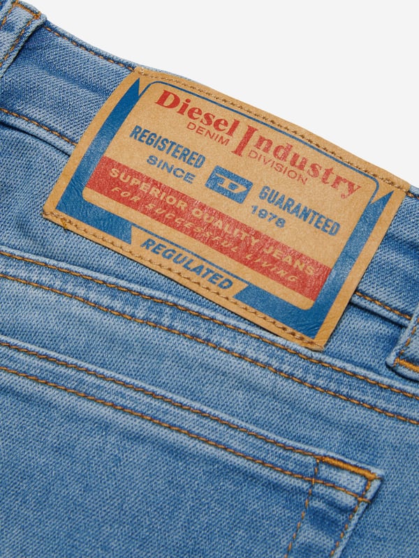 Diesel envision stunning innovative properties in their sleek silhouettes. These girls jeans embody the label's rebellious spirit by experimenting with bold, distinctive styles. Crafted in a bootcut style with a low waist and higher back coverage. This classic slim jean with a bohemian attitude hugs the body from the hips to the knees. Crafted from JoggJeans¬Æ fabric for the utmost comfort. They are in a clean light blue finish, enriched with a super-stonewashed treatment, broken details, frayed hems and contrasting-colour stitching. 65% Cotton, 30% Polyester, 5% Elastane