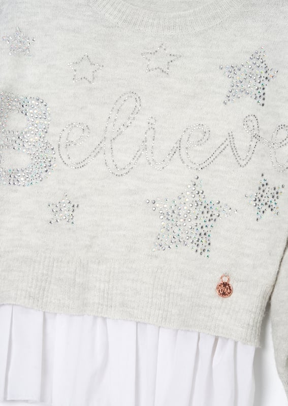 Is this the most perfect Winter knit? You sweater BELIEVE it! Crafted from soft   yarn and encrusted with stunning jewels. it also features a mock shirt panel for ultimate style credits.