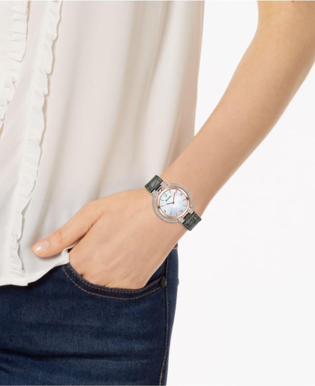 This Bulova Rubaiyat Analogue Watch for Women is the perfect timepiece to wear or to gift. It's Rose Gold 35 mm Round case combined with the comfortable Grey Leather watch band will ensure you enjoy this stunning timepiece without any compromise. Operated by a high quality Quartz movement and water resistant to 3 bars, your watch will keep ticking. This elegant, fashionable watch setted with beautiful diamonds is a perfect gift for New Year, birthday,valentine's day and so on High quality 19 cm length, 16 mm wide Grey Leather strap with a Buckle Case diameter: 35 mm, Case height: 8 mm and Case color: Rose Gold/Dial color: Mother of pearl