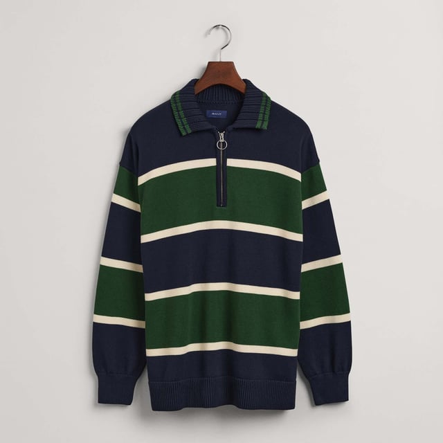 Taking elements of the classic Rugger silhouette  this compact knit has been crafted in a barstripe design for an extra sporty look. With an oversized fit and half-zip  chunky knit collar  this preppy icon has been revised for a modern style.