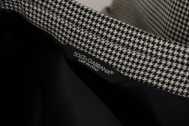 100% authentic Dolce & Gabbana Gray Checkered Wool Blazer
  New with tags
  Single breasted with notch lapels
  Made in Italy
  Gray checkered color
  1 button fastening
  Logo details
  Material: 100% virgin wool
  Lining: 100% Silk
Material: 100% Virgin Wool
