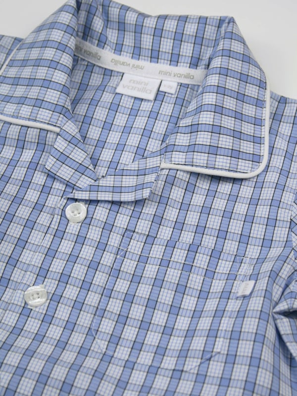 Boys mini check PJ with shorts in shades of mid blue. Spring & Summer weight 100% Cotton with short sleeves
Spotlight on Summer styling with our Traditional Shortie pyjamas, button through top with a front pocket and contrast piping. The shorts have an elastic waist, making them easy to get on and off.
100% Cotton
Elastic waist
Front pocket
Button through top
Machine washable
Contrast piping detail