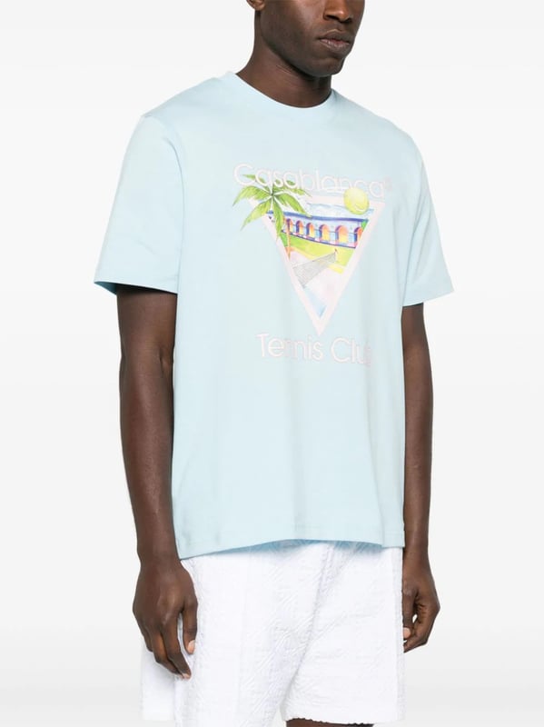 Casablanca's graphics often depict a fantastical world of sporty utopian scenes. The illustrative print on this organic cotton T-shirt portrays a Mexican-inspired landscape with a tennis court in the middle.