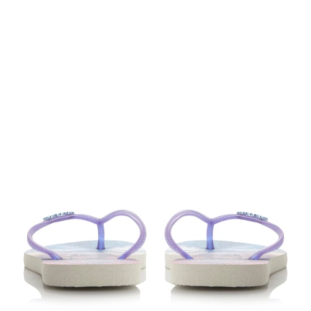 Make a splash poolside with this pretty landscape print flip flop. It comes with metallic brand logo, toe post strap and a tropical print.