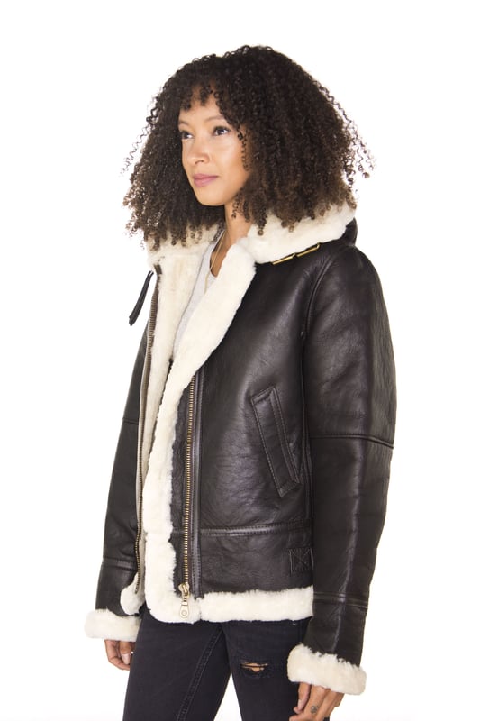 Originating in 1934, the B3 was designed to be as warm and comfortable as possible, and this jacket excels in that regard. Crafted out of the highest-grade double-faced sheepskin this is a premium jacket which features a full length YKK zip fastening that can be left open at different lengths to expose the thick sheep skin lining which appears in a rich ginger or cream colour. The collar features a buckle that allows it to be fastened up for extra warmth and the waist features straps that can adjust the wear of this jacket to compliment the slim fit design. We have also introduced two open pockets at the waist for easily accessible storage. • Crafted from high-quality double-faced sheepskin • Thick sheepskin lining is renowned for providing warmth and comfort • Features a YKK zip closure and a buckle to fasten the collar • With two open pockets at the waist