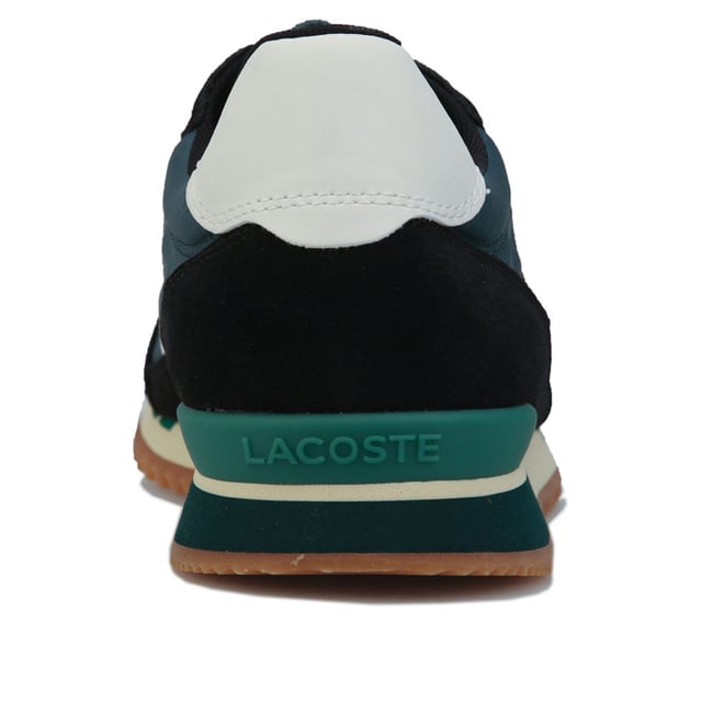 Men's Lacoste Partner Retro Trainers in Green Mens Lacoste Partner Retro Trainers in green.- Leather and suede uppers.- Lace up fastening.- Lacoste patch on the tongue.- Tonal branding on the heel and a green embroidered crocodile on the quarter.- Rubber outsole.- Suede and Leather upper Textile lining Synthetic sole.- Ref: 738SMA00061X3